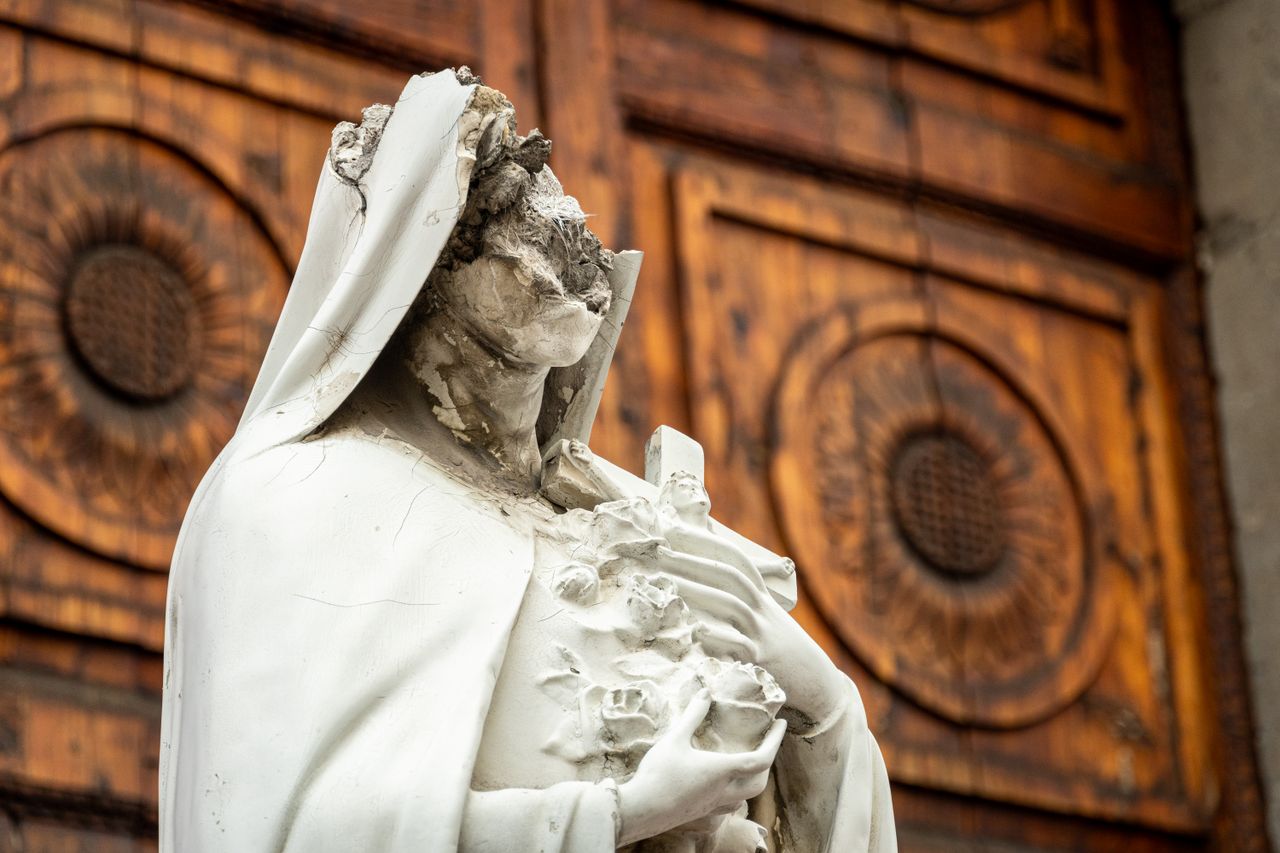 Mastering the First Impression: Your intriguing post title goes here Weathered Virgin Mary statue outside an abandoned church, Mexico City.